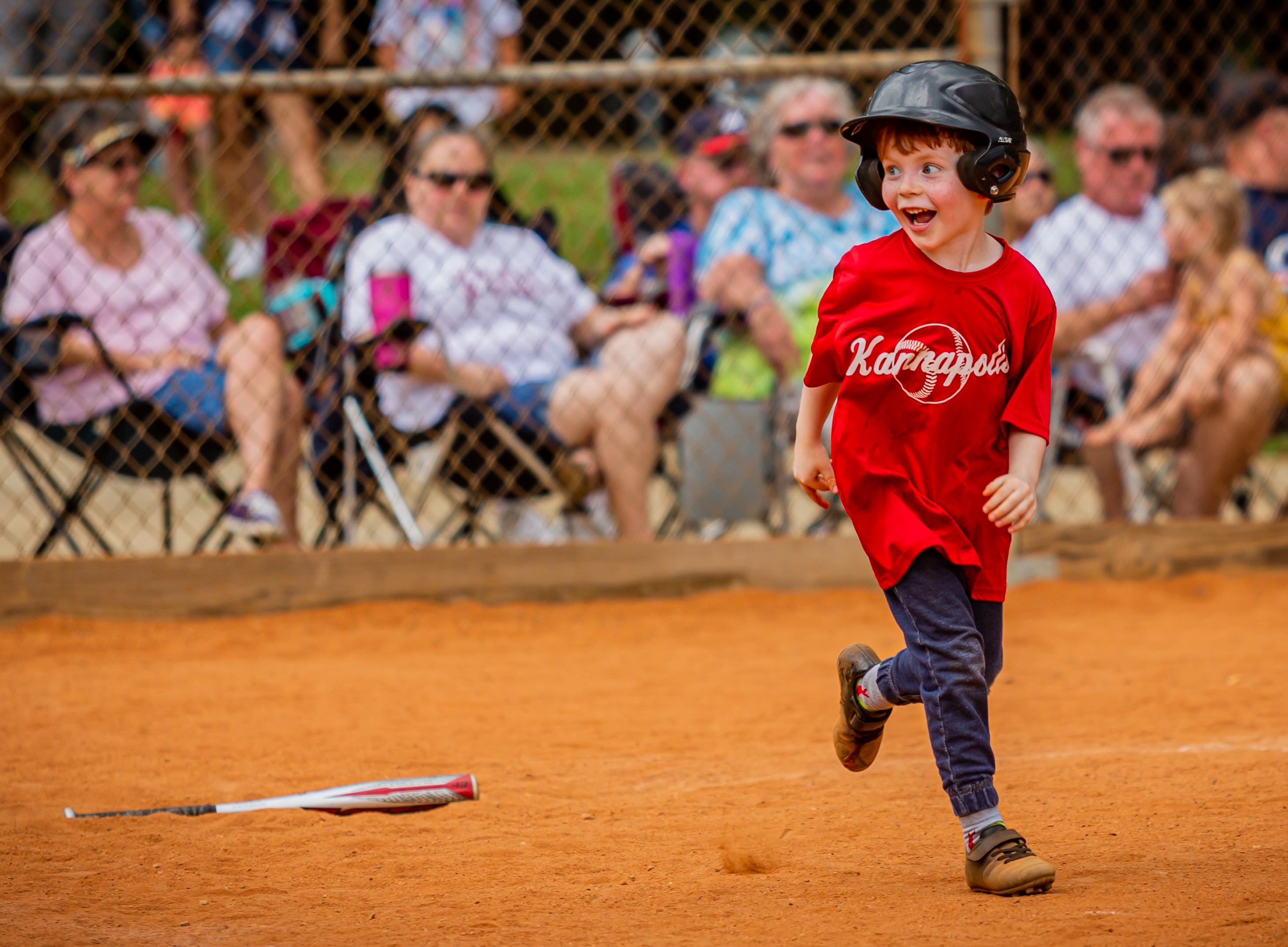 tball boy running to first base