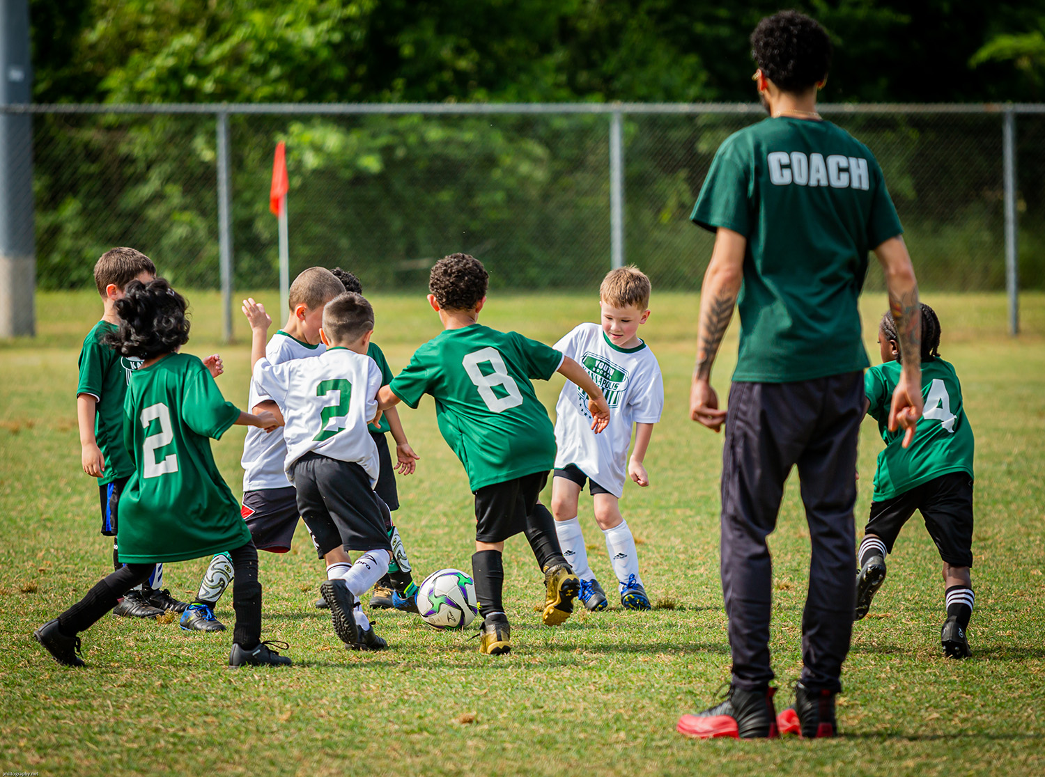 soccer coach with team