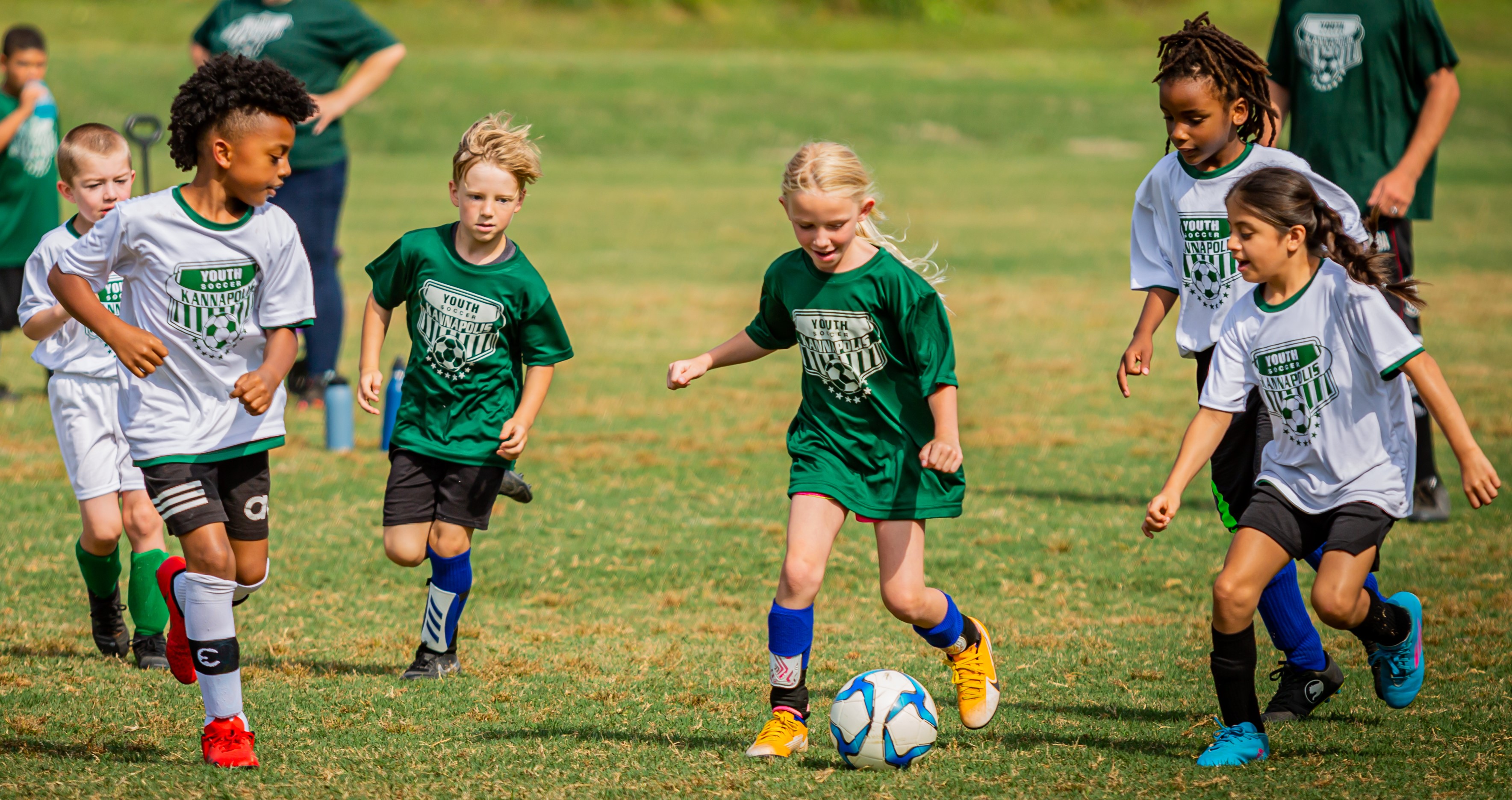 boys and girls playing soccer